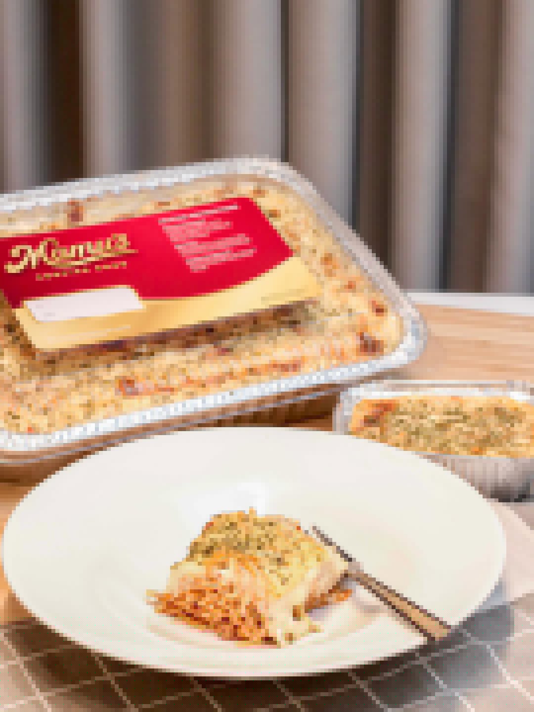 Plated baked cream cheese spaghetti with branded tray